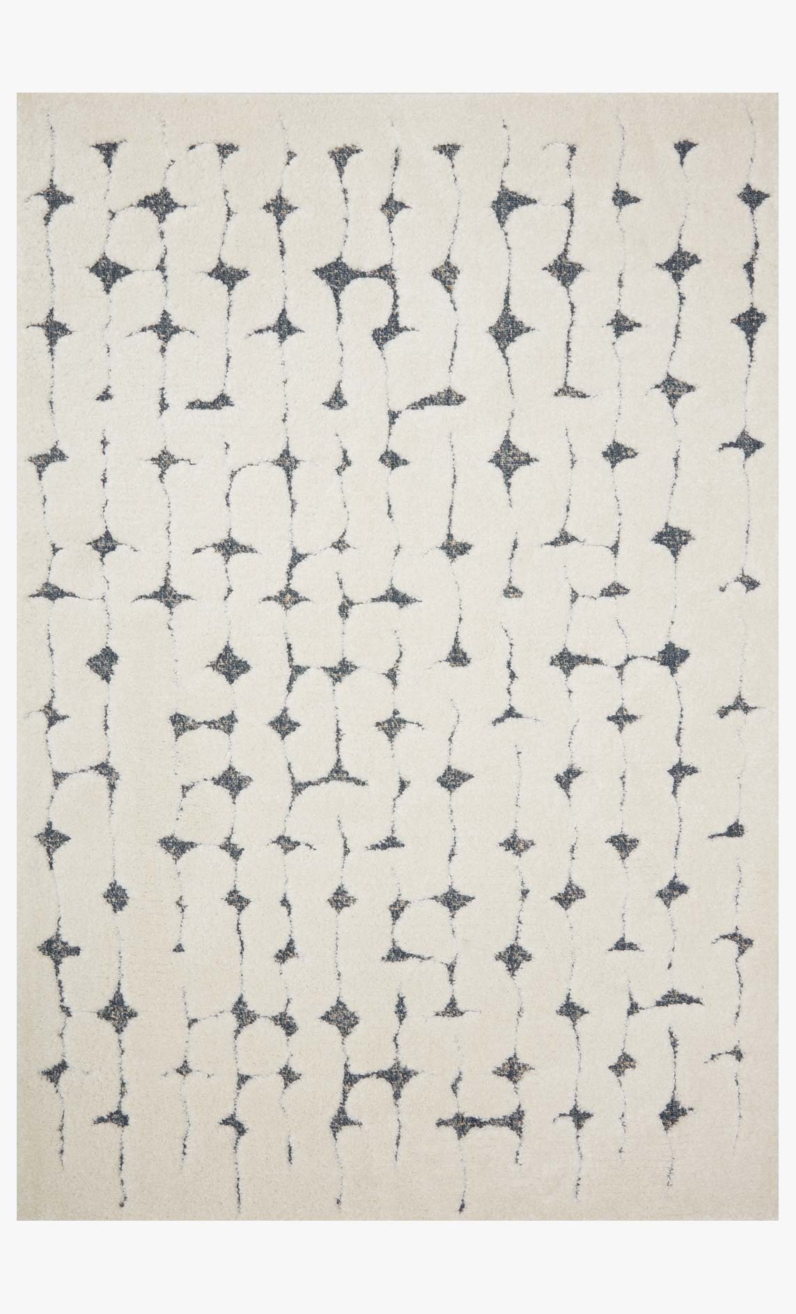 Contemporary power-loomed rug with trellis star pattern, white ground and navy accents