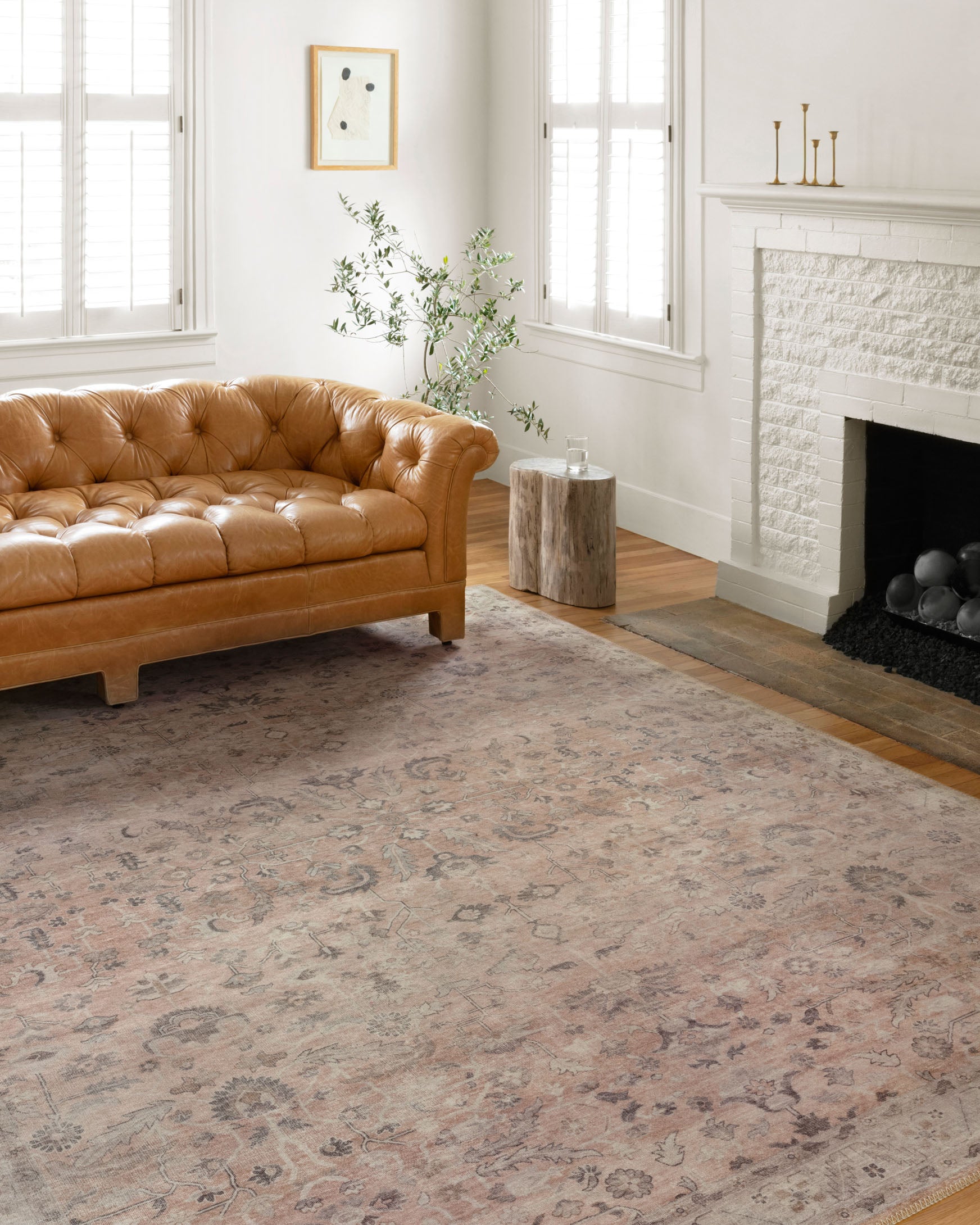 Blush traditional rug with faded ornate motif and wide border