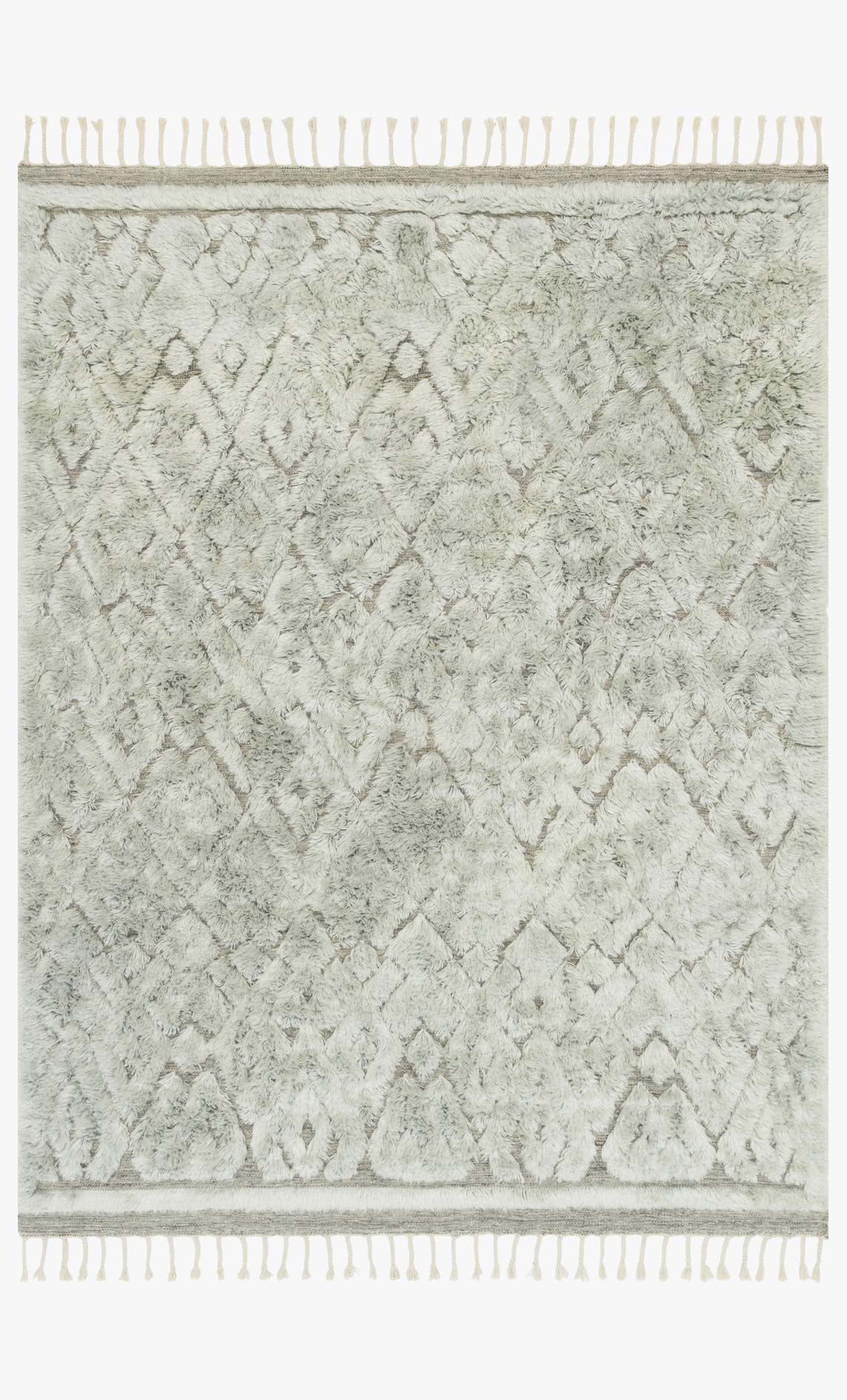 Hand-loomed area rug in grey and mist with diamond pattern and fringe tassels