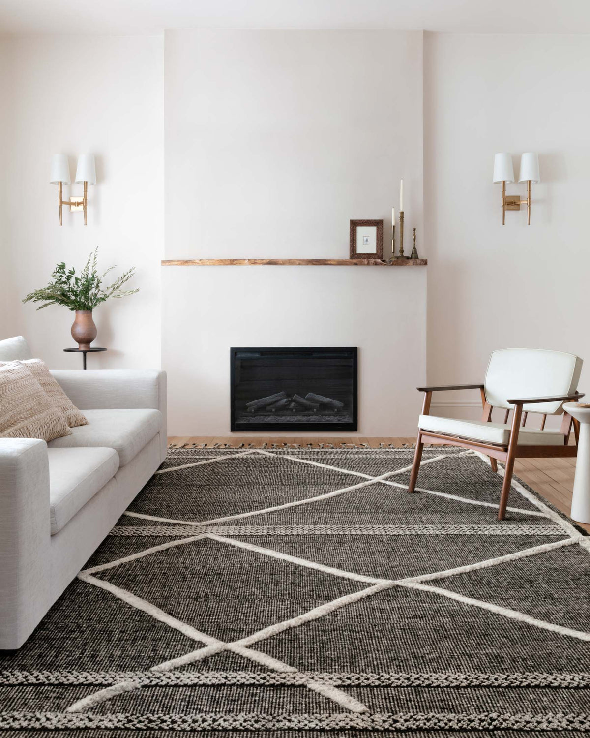 Beige and charcoal geometric rug with diamond pattern and light bordered lines