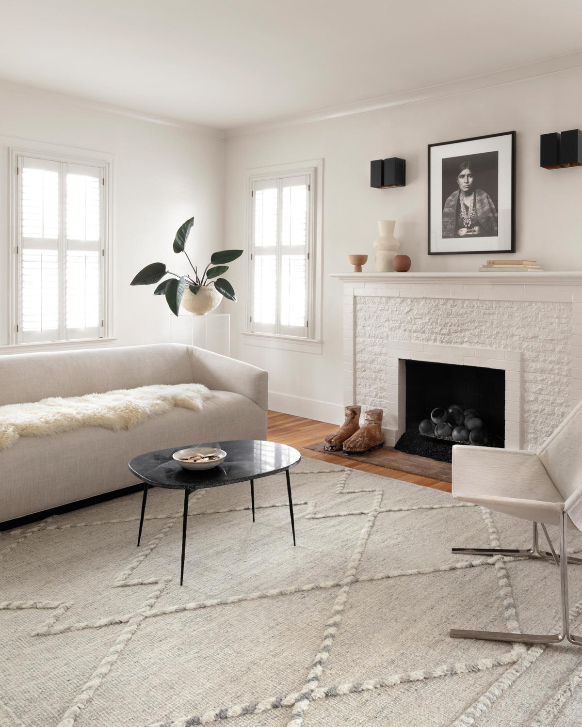 Geometric hand-knotted rug in ivory with light gray grid and thin border, short tassel fringe