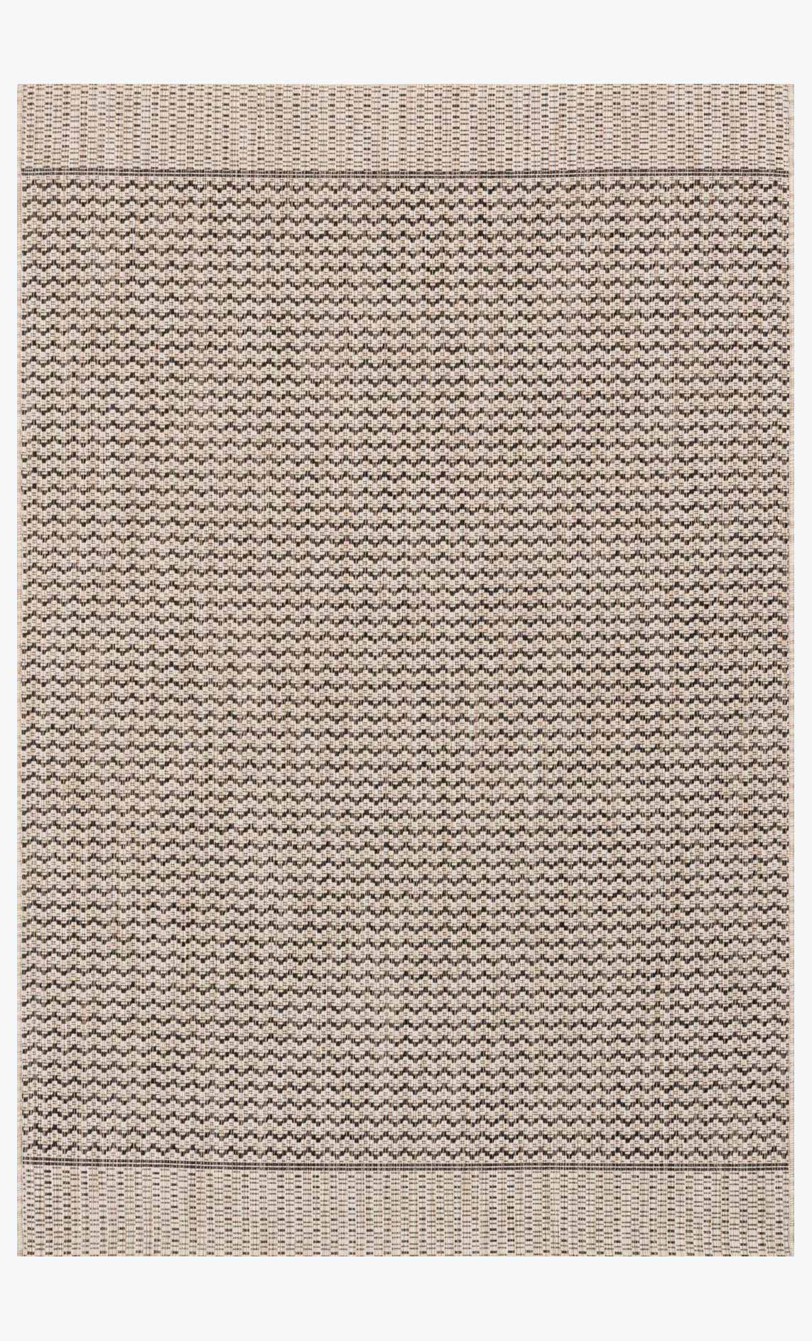 Grey and black geometric indoor/outdoor rug with light border, flatwoven texture