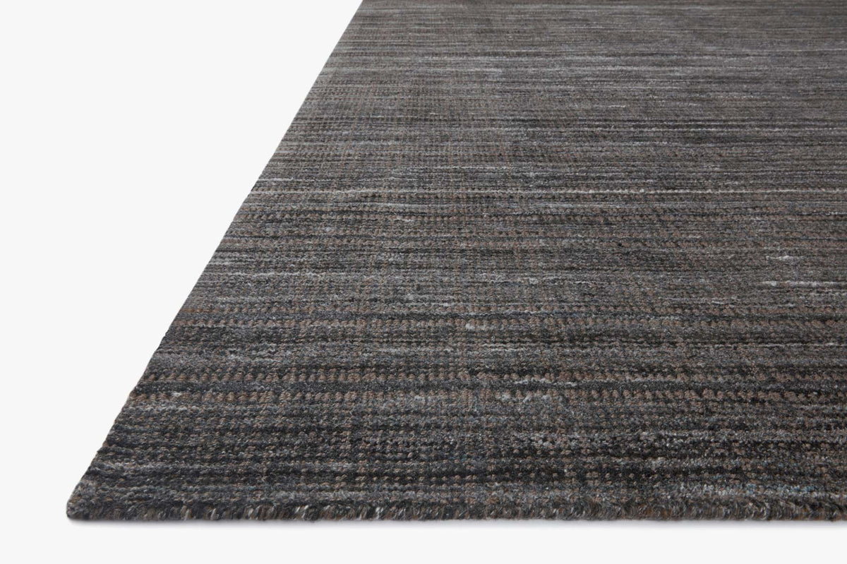 Hand-loomed area rug in dark graphite charcoal, textured horizontal stripe weave.