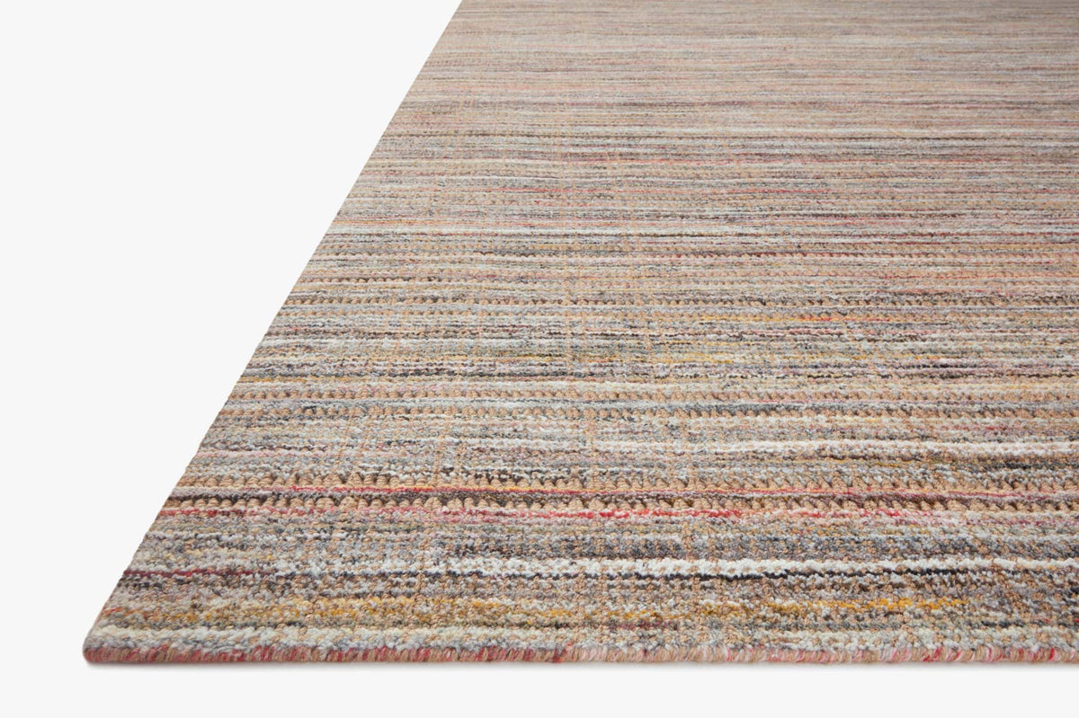Corner view of natural hand-loomed rug with low-profile flatweave stripes