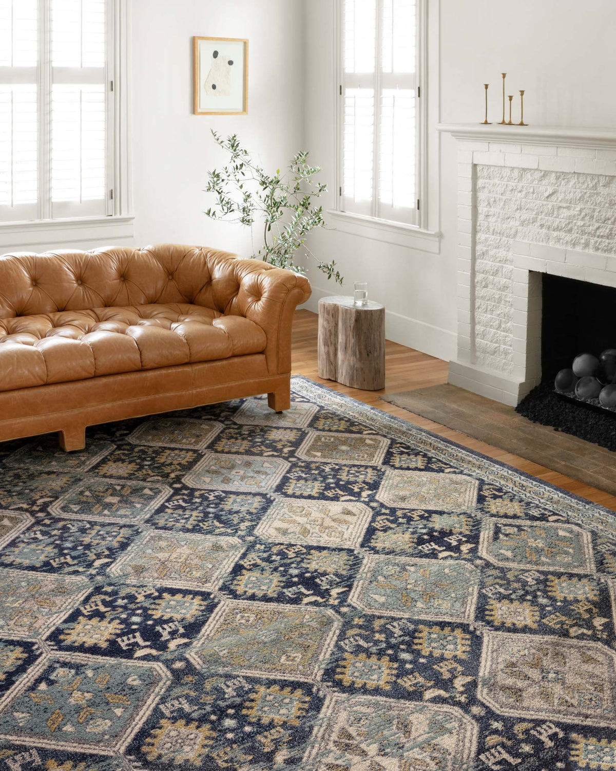 Navy and blue transitional rug with ornate geometric square motifs and border