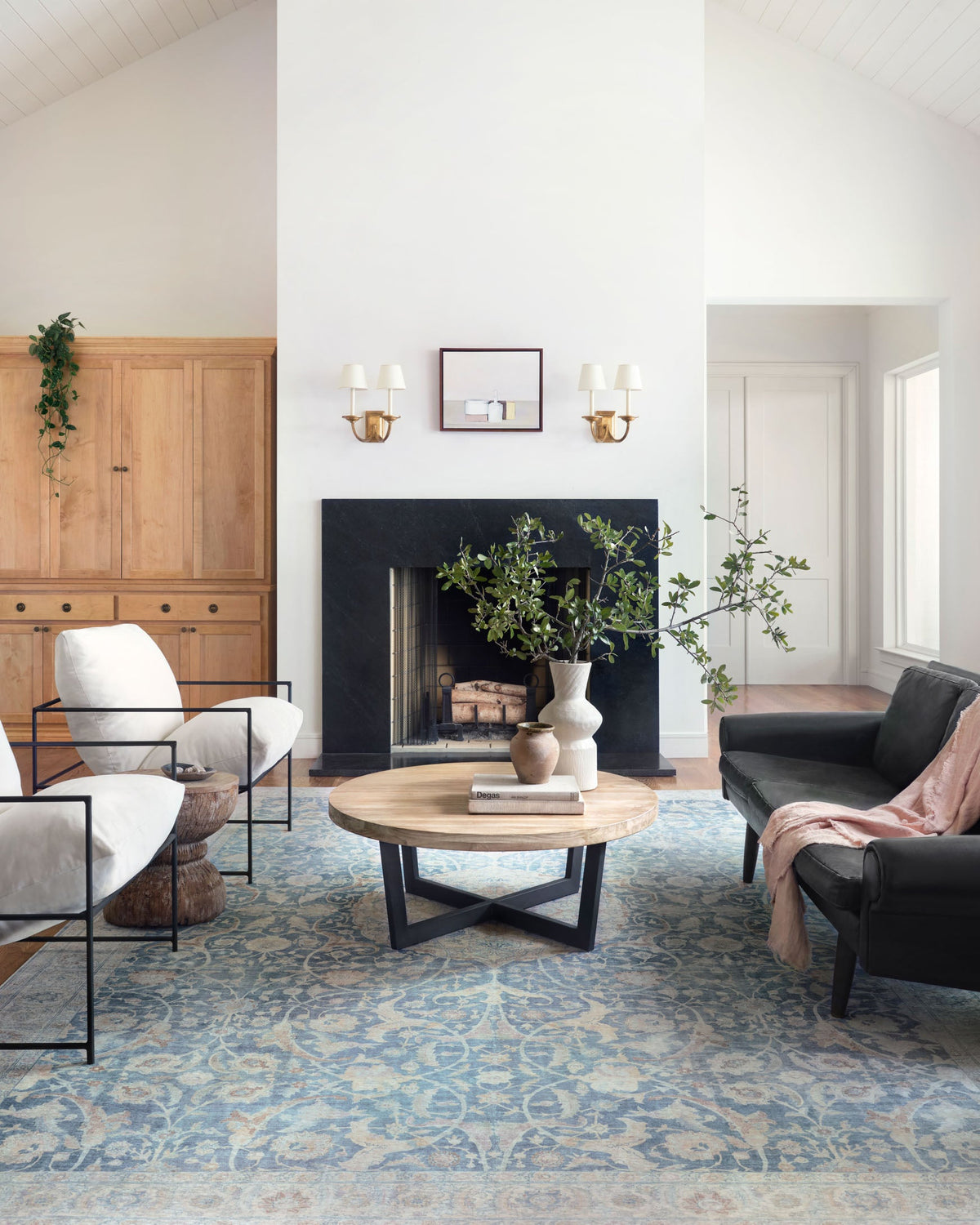 Traditional power-loomed rug in antique cream and sky blue with detailed floral motifs.
