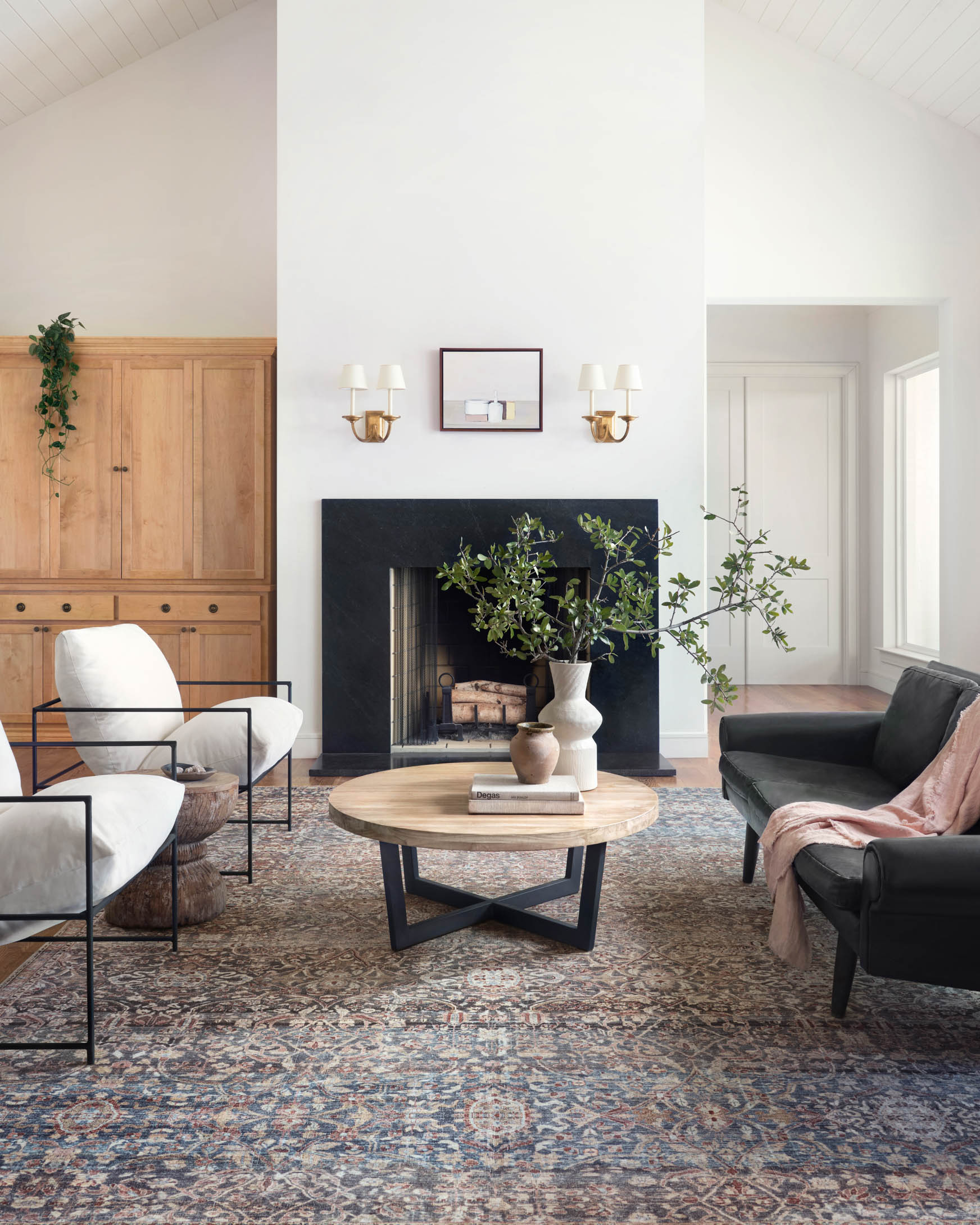 Traditional power-loomed rug featuring intricate blue and tan scrollwork with spice accents