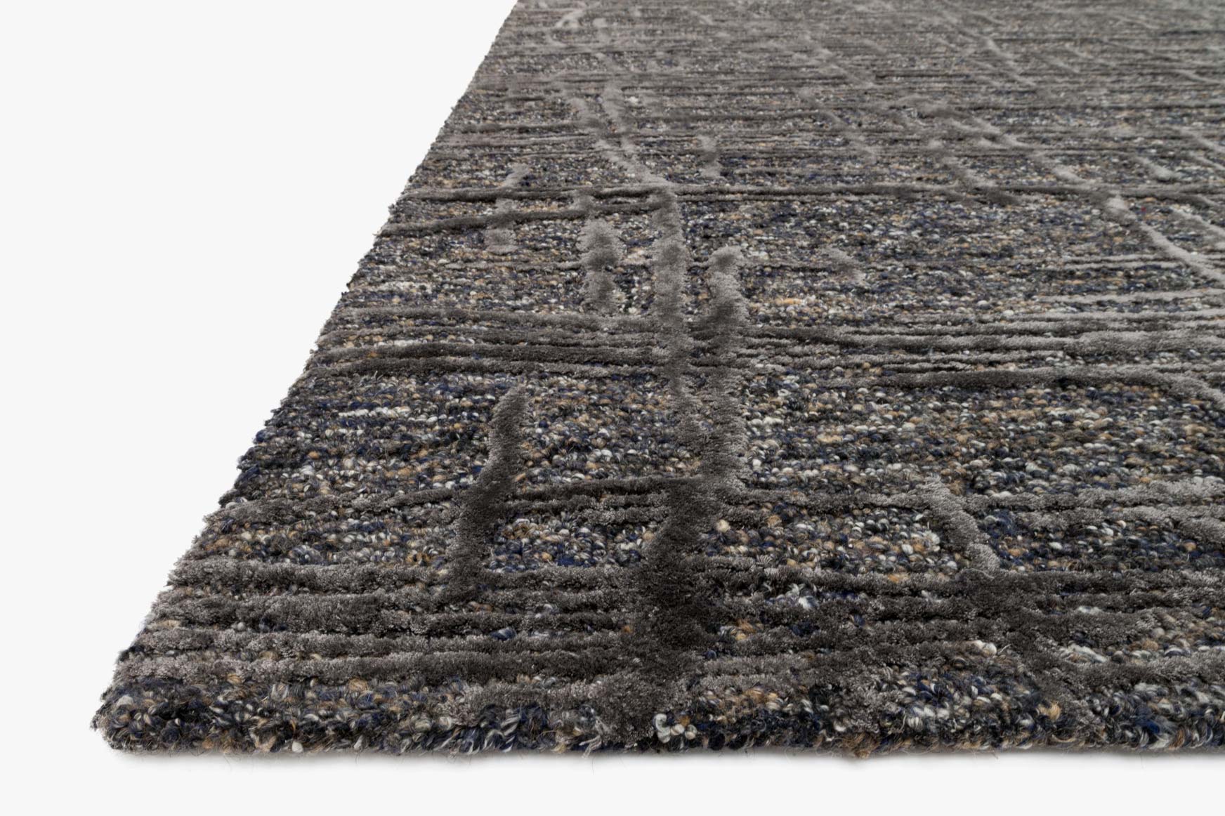 Charcoal rug corner with detailed low-pile texture and abstract mottled pattern
