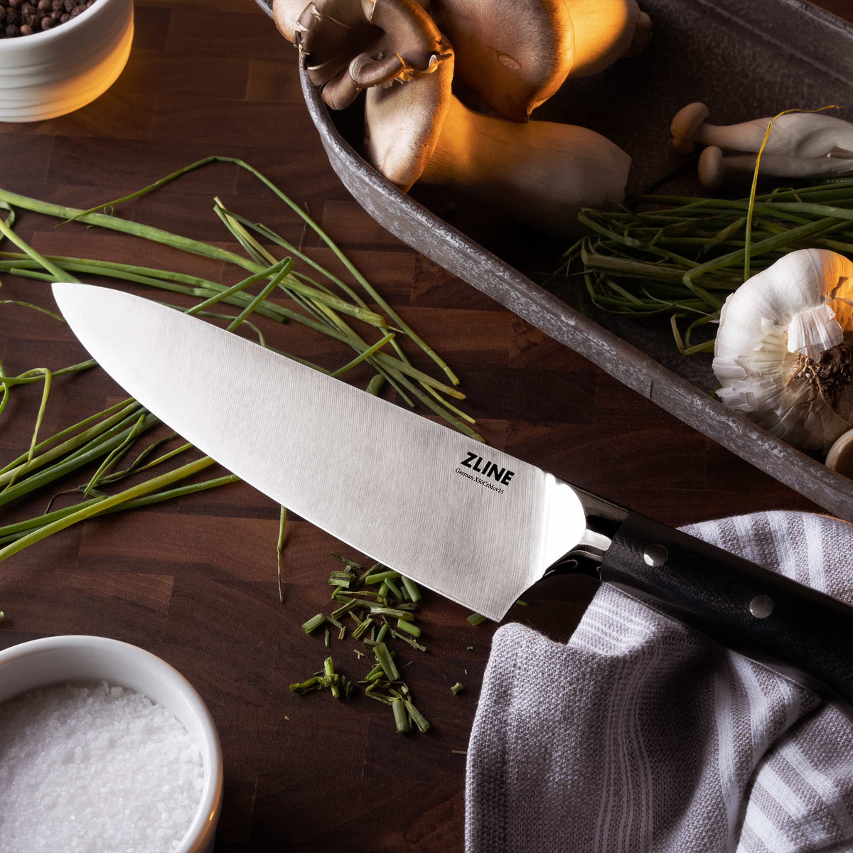 8-inch chef’s knife with stainless blade and black handle with white dot accents