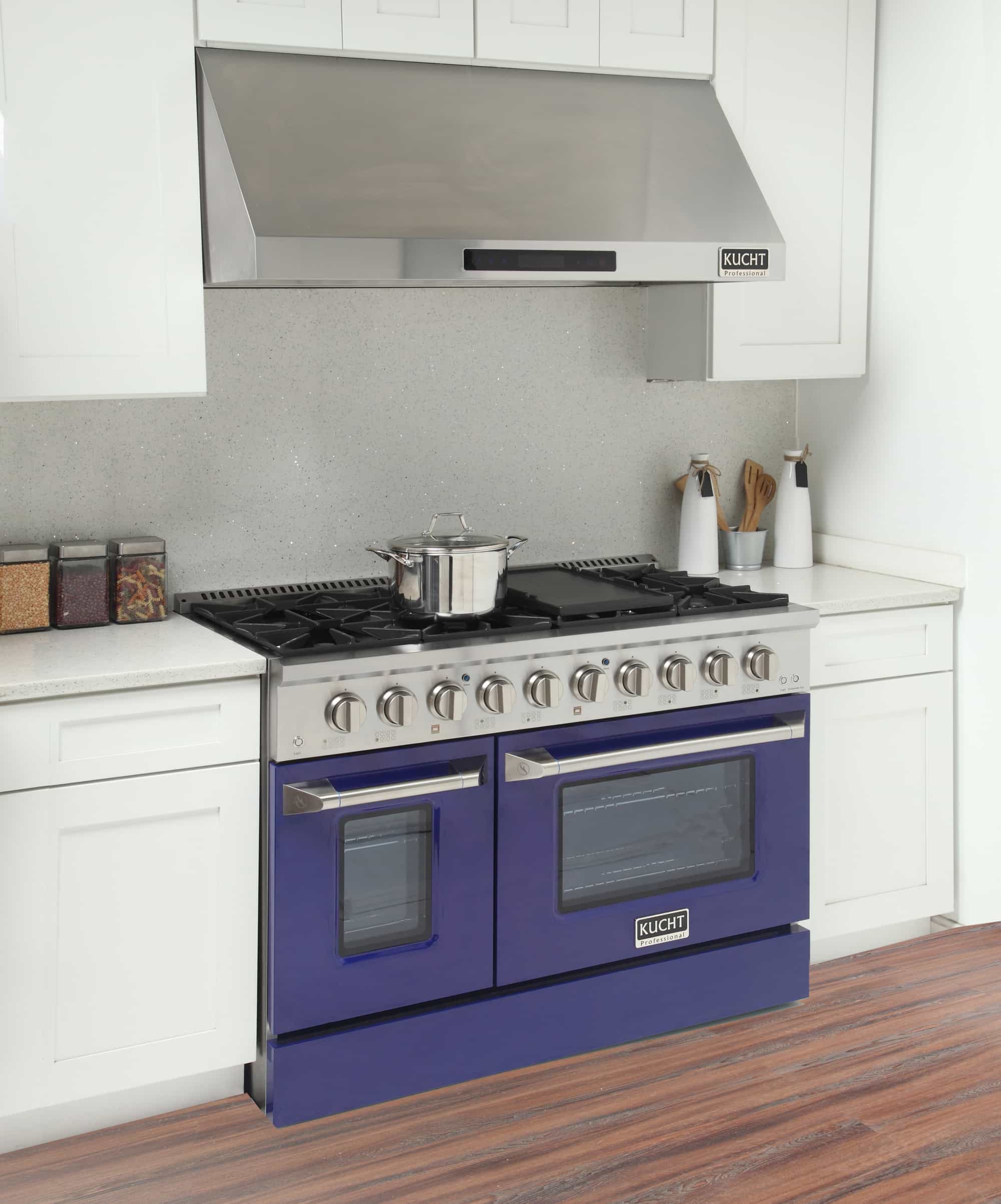 Kucht dual fuel range in kitchen setting with stainless top and blue oven doors