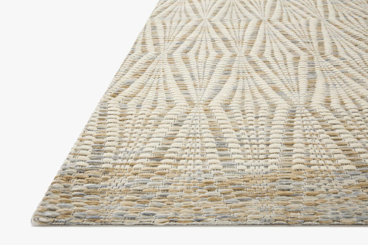 Hand-woven rug corner with diamond lattice texture in ivory and sand.