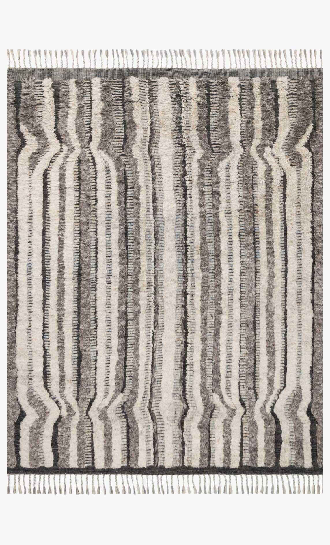 Hand-knotted rug with charcoal and stone geometric keyhole lines, fringed border