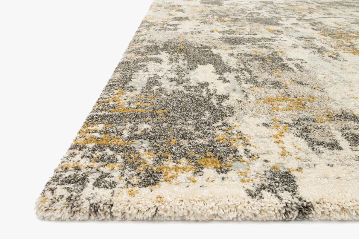 Corner view of contemporary power-loomed rug with short fringe, granite gray and cream pattern