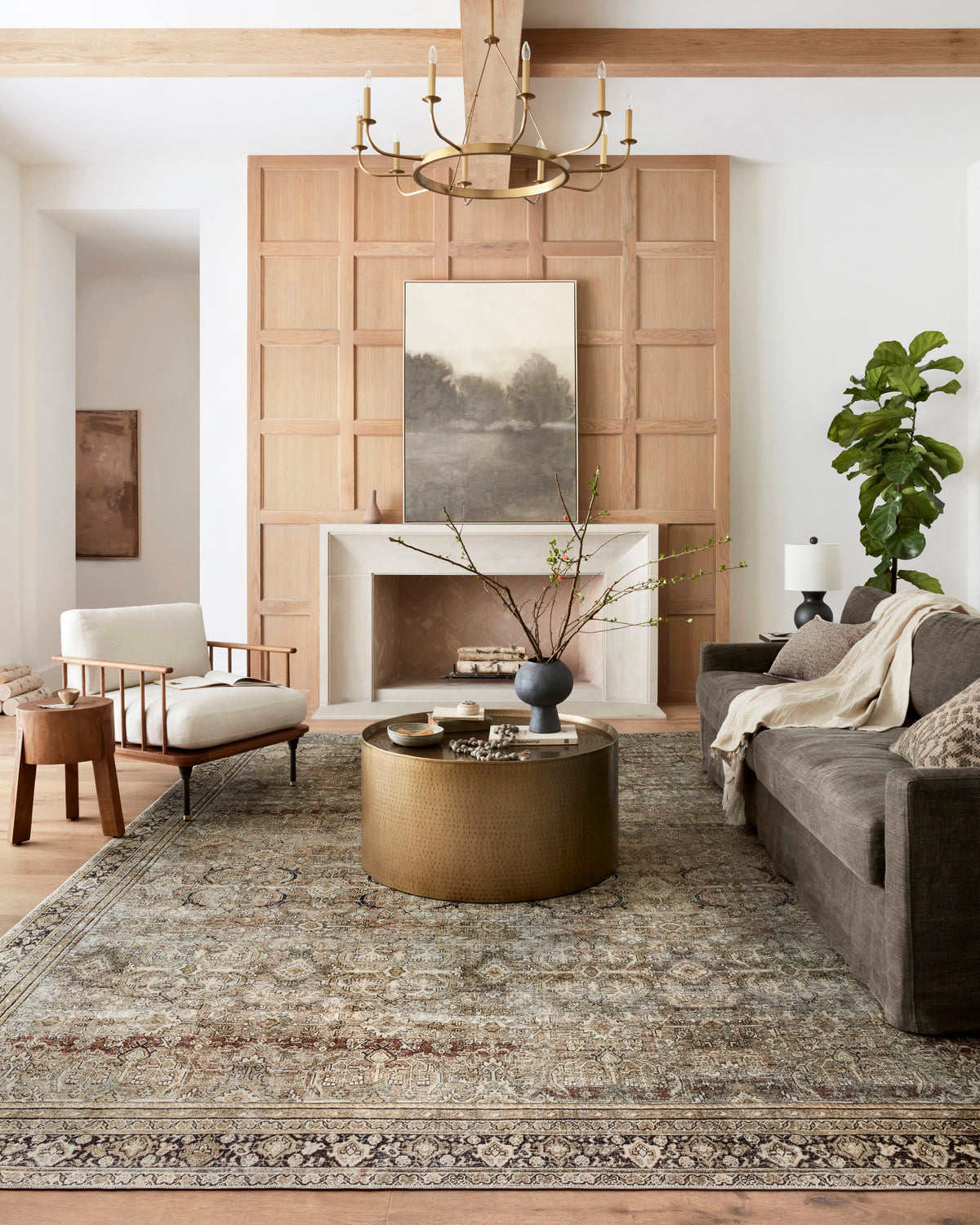 Traditional power-loomed rug featuring a faded vintage motif, olive and charcoal tones.