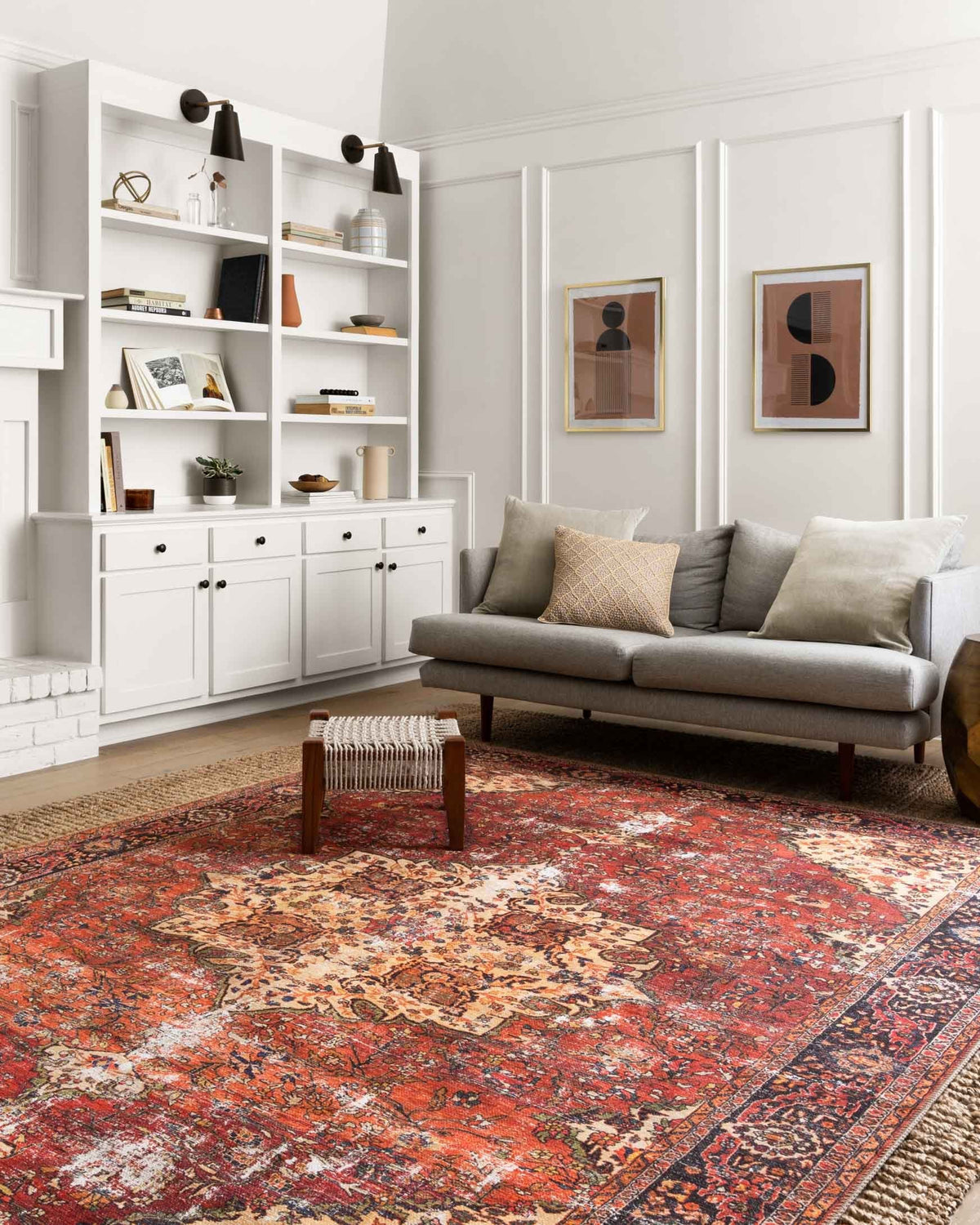 Red traditional rug with distressed medallion motif and dark navy border