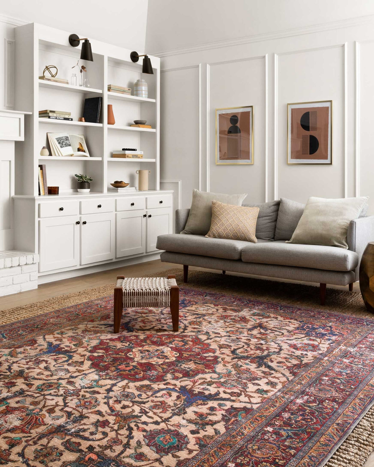 Traditional area rug with cream ground, red and blue ornate central medallion design