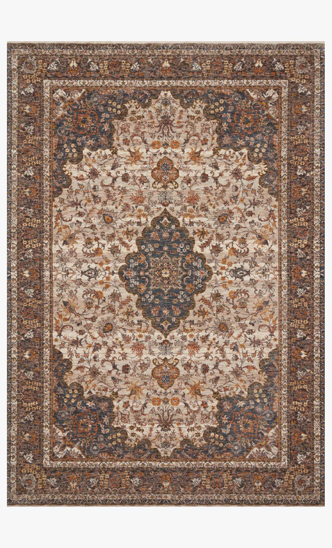 Traditional power-loomed rug with beige field and navy, rust, and ocean-blue motifs