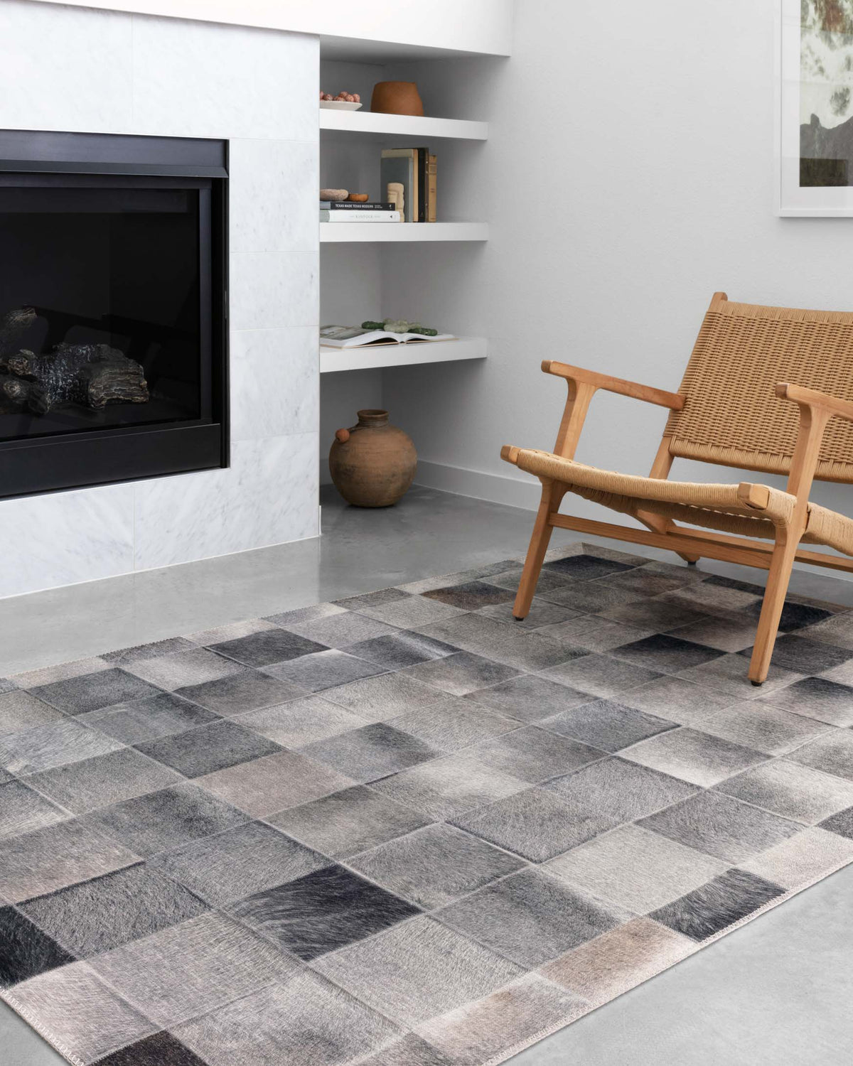 Charcoal and grey area rug with grid of muted square blocks