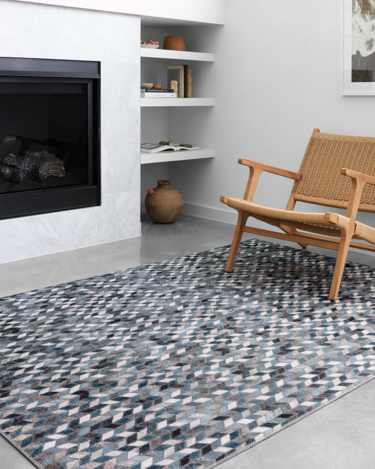 Ocean and gray geometric rug on floor with short pile