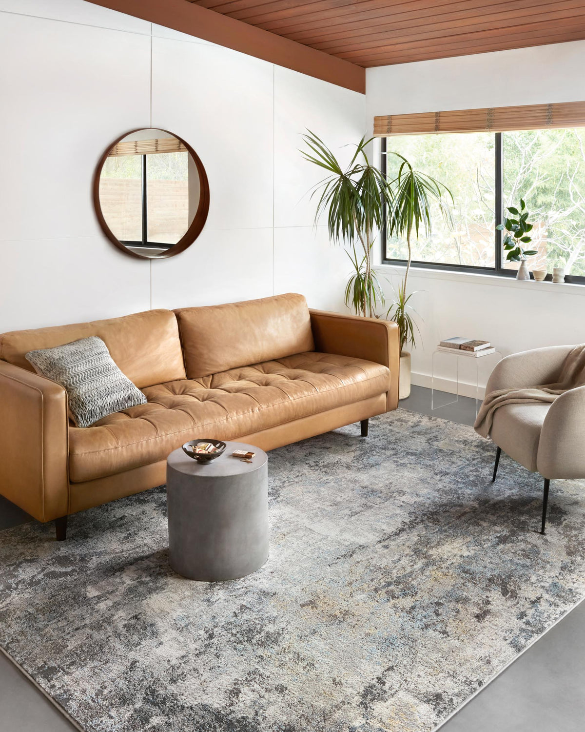 Silver and slate abstract area rug displayed on the floor