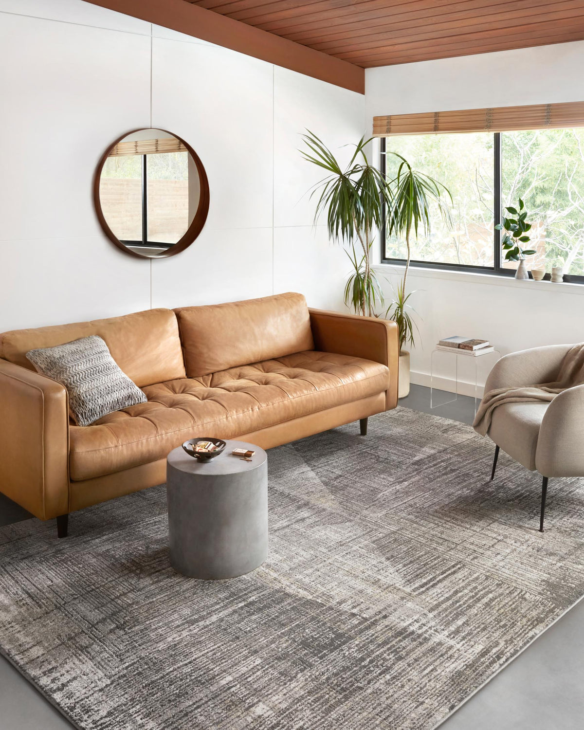 Contemporary power-loomed area rug in gray with subtle gold accents, distressed texture