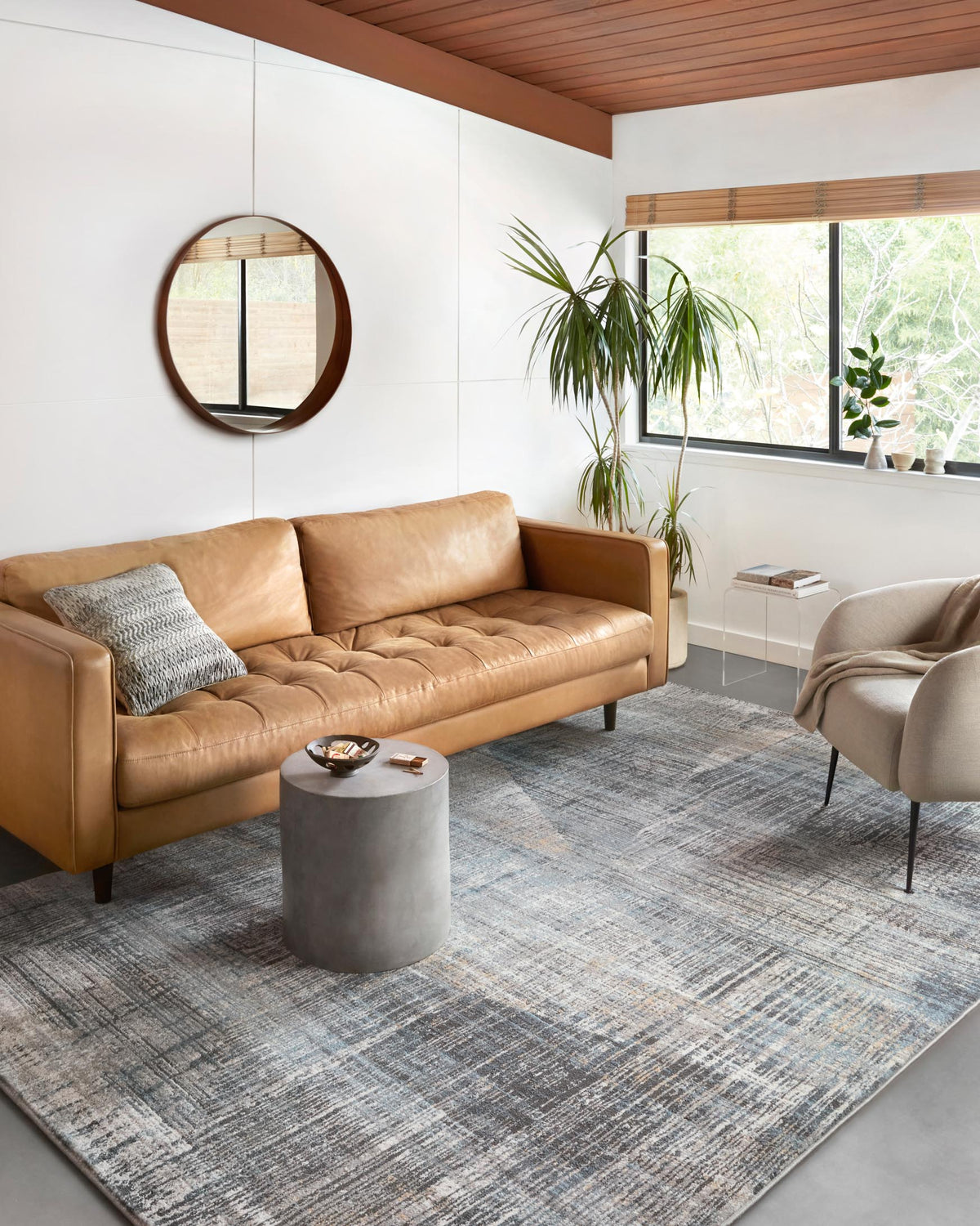 Abstract granite-and-mist area rug with distressed blue-gray lines and texture