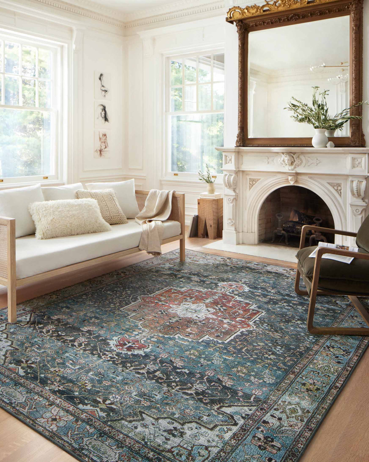 Ocean-blue and brick traditional rug with central medallion and floral motifs.