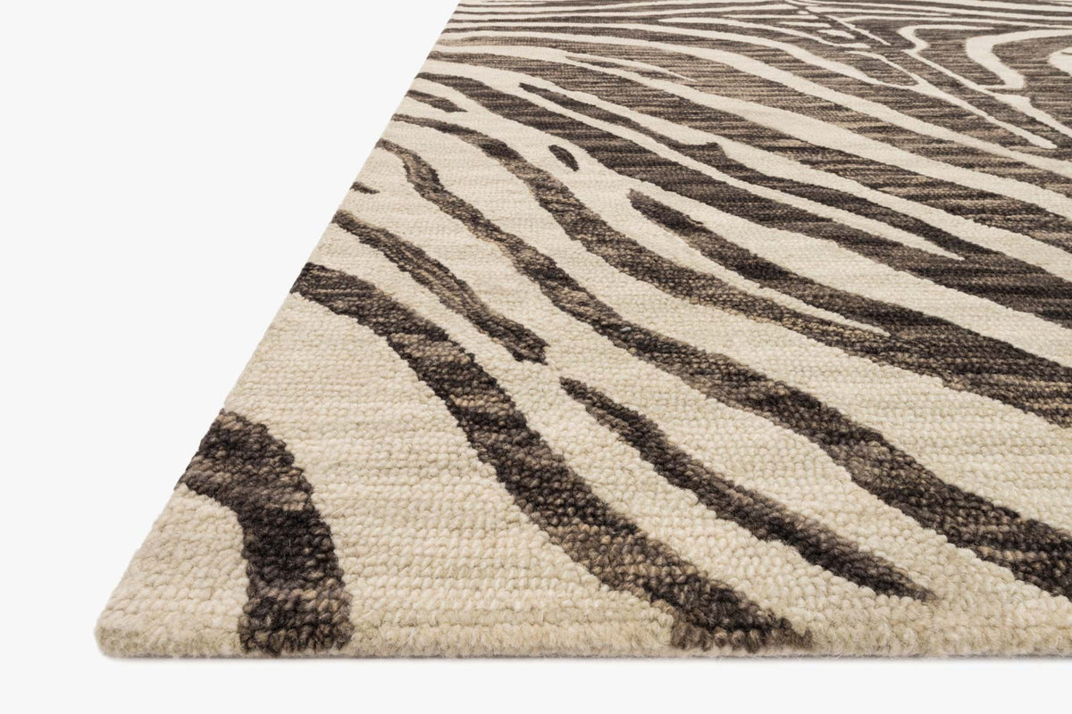 Contemporary hooked rug corner view, ivory and dark brown striped abstract motif