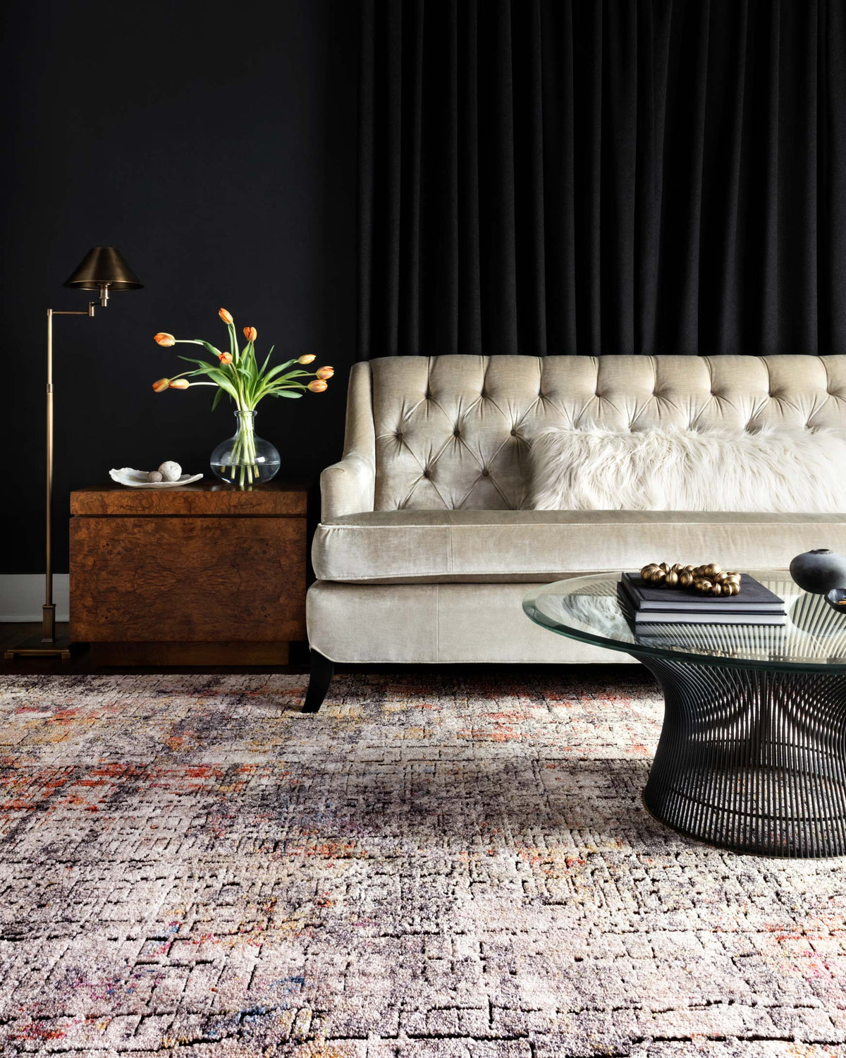 Graphite gray abstract rug with multicolor speckles and sunset orange highlights