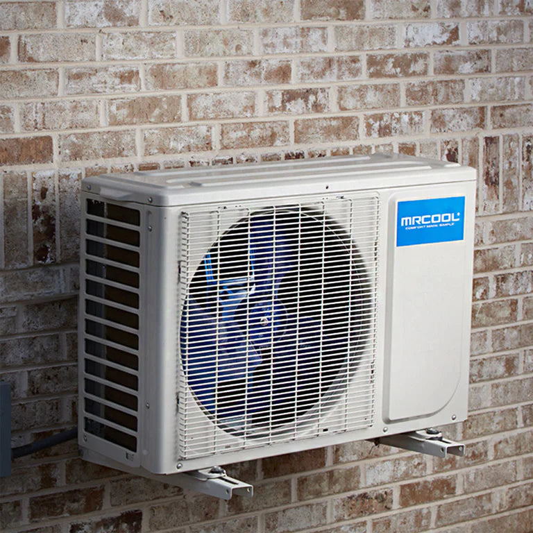 MRCOOL outdoor condenser unit mounted on a brick wall with visible wall brackets