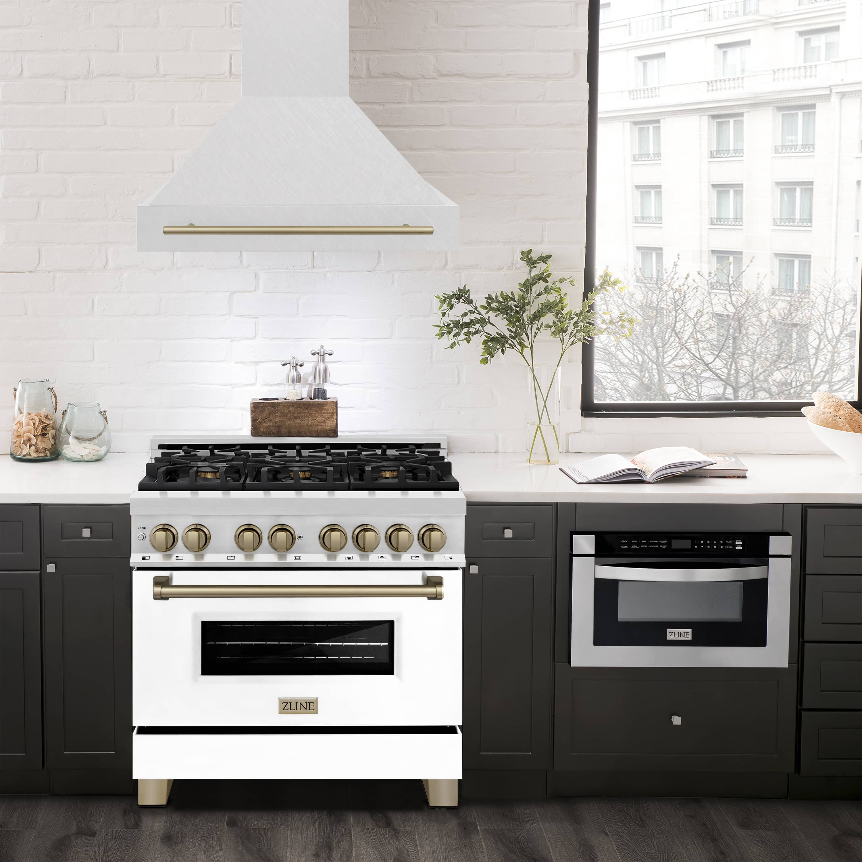 Satin stainless wall mount range hood with bronze trim above electric stove