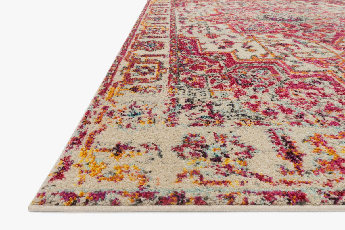 Power-loomed transitional rug, ivory ground with pink and blue floral motifs, angled view