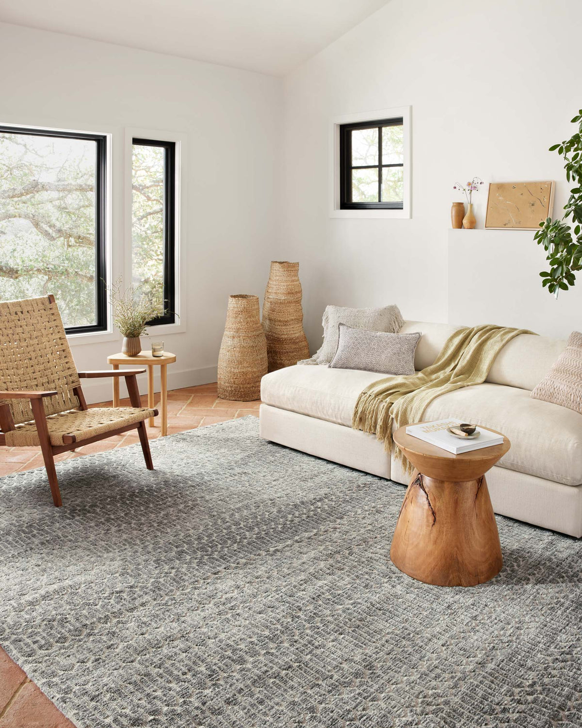 Geometric ivory-and-charcoal area rug in a large rectangular layout