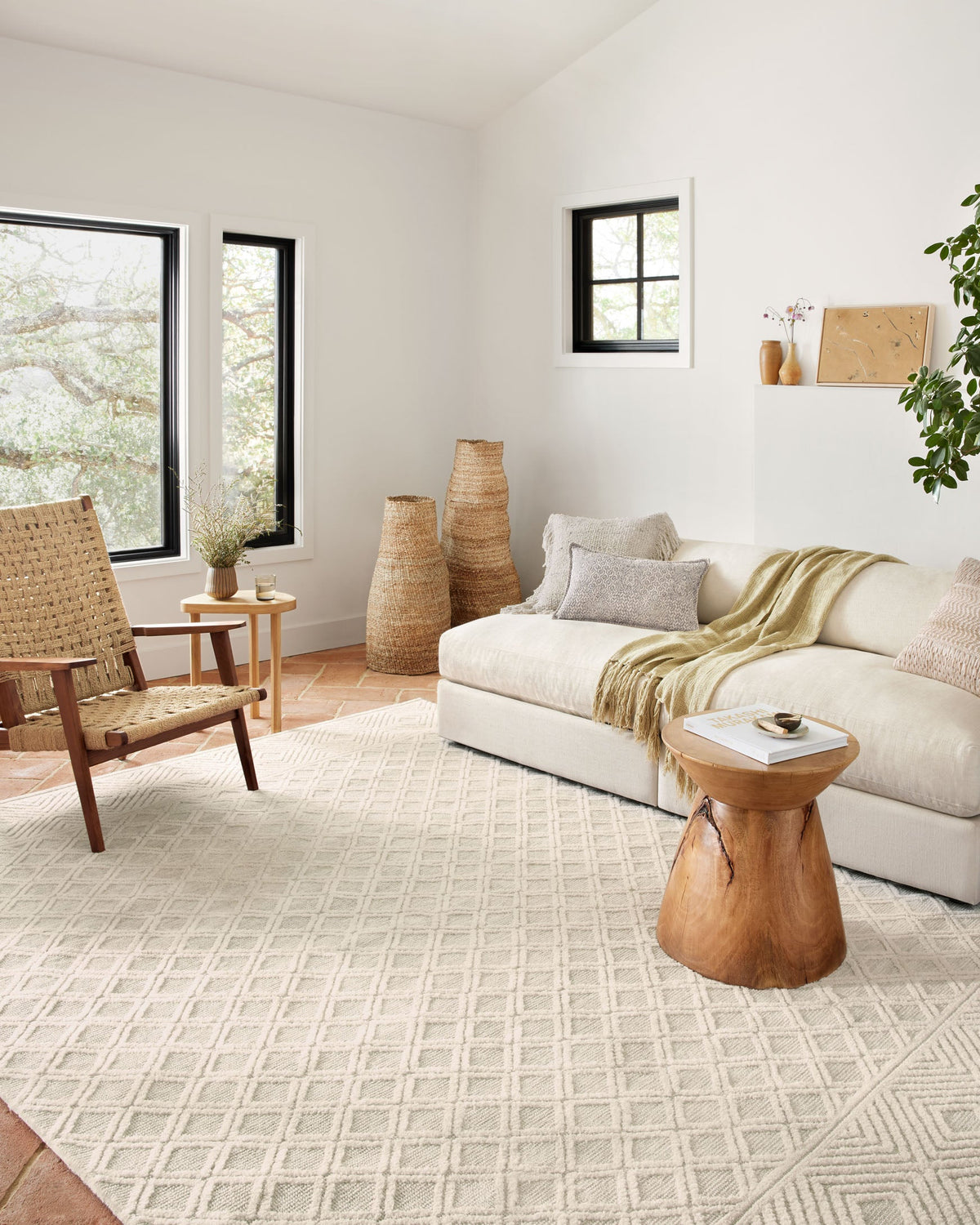 Ivory and natural area rug with geometric chevron lines, flat woven texture