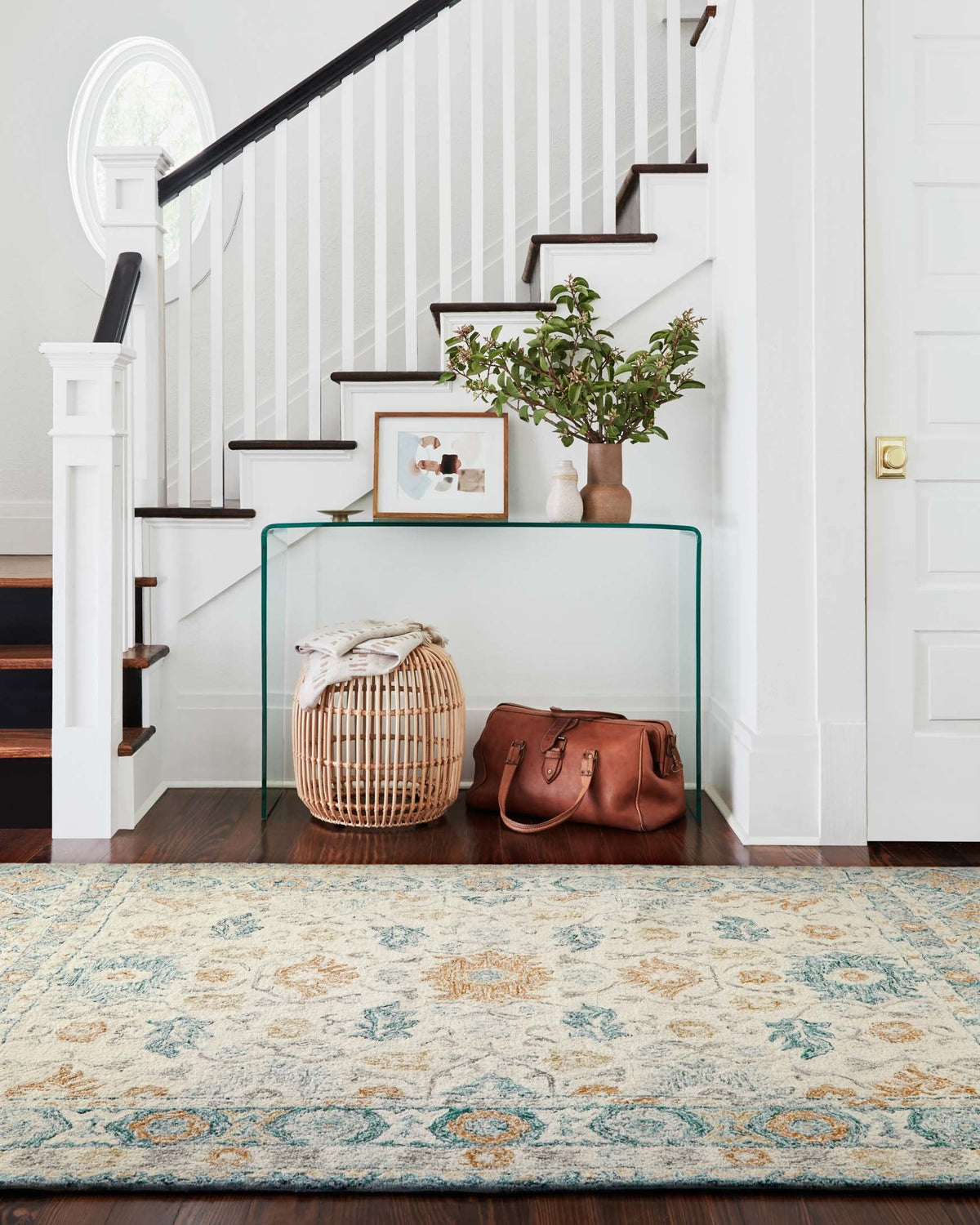 Contemporary ivory hooked rug with blue and orange distressed botanical pattern