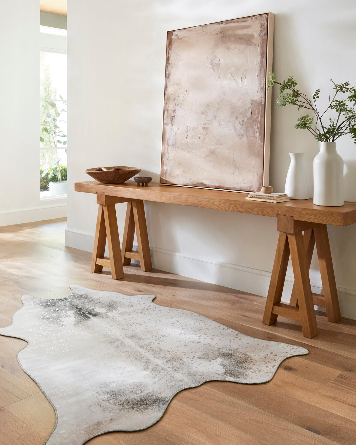 Silver-gray speckled cowhide-shaped area rug, contemporary power-loomed