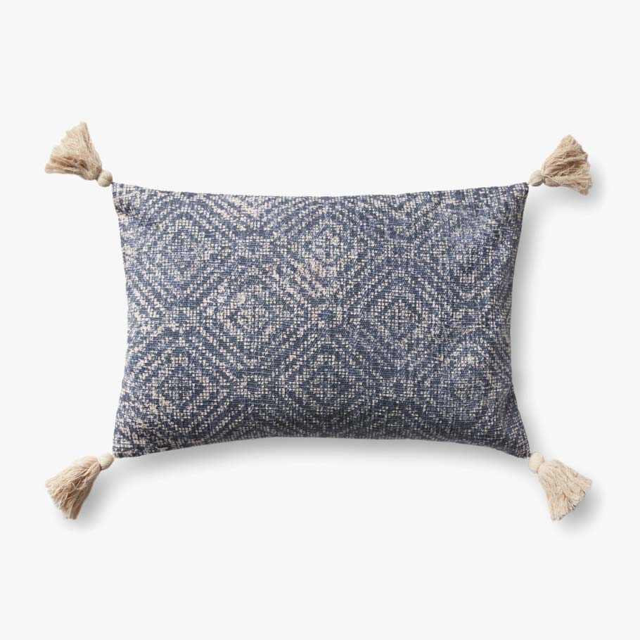 Blue patterned lumbar pillow with tassel corners and woven texture