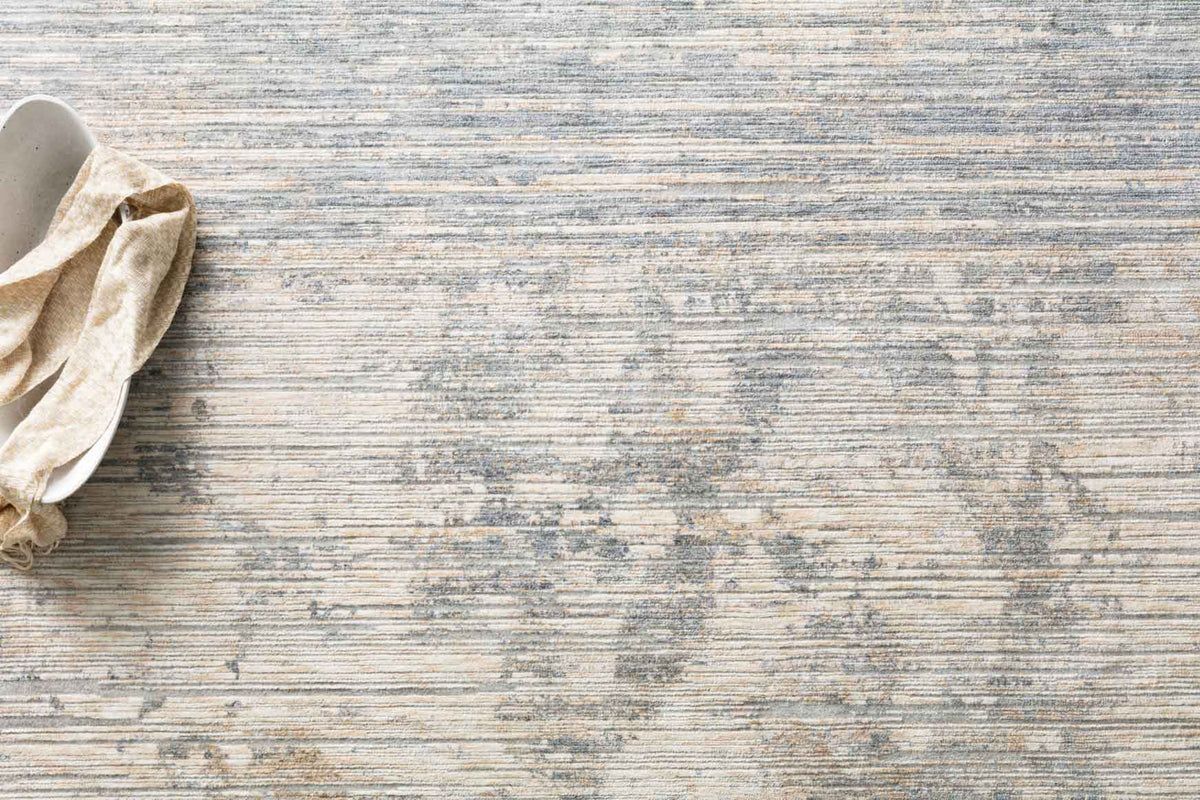 Loloi Pandora rug close-up with layered ivory-and-blue texture and horizontal stripes