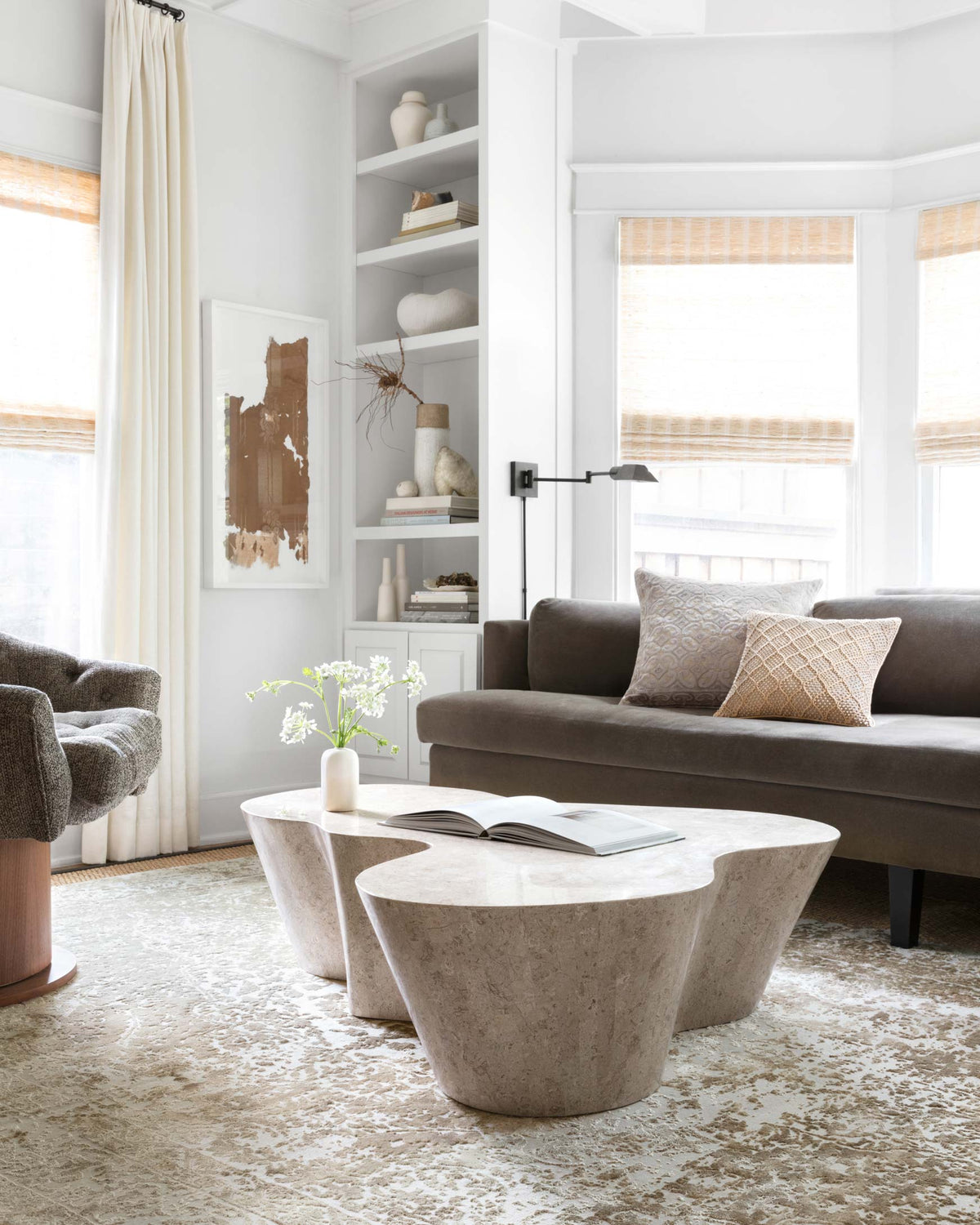 Transitional power-loomed rug in champagne and light grey with distressed motif in room