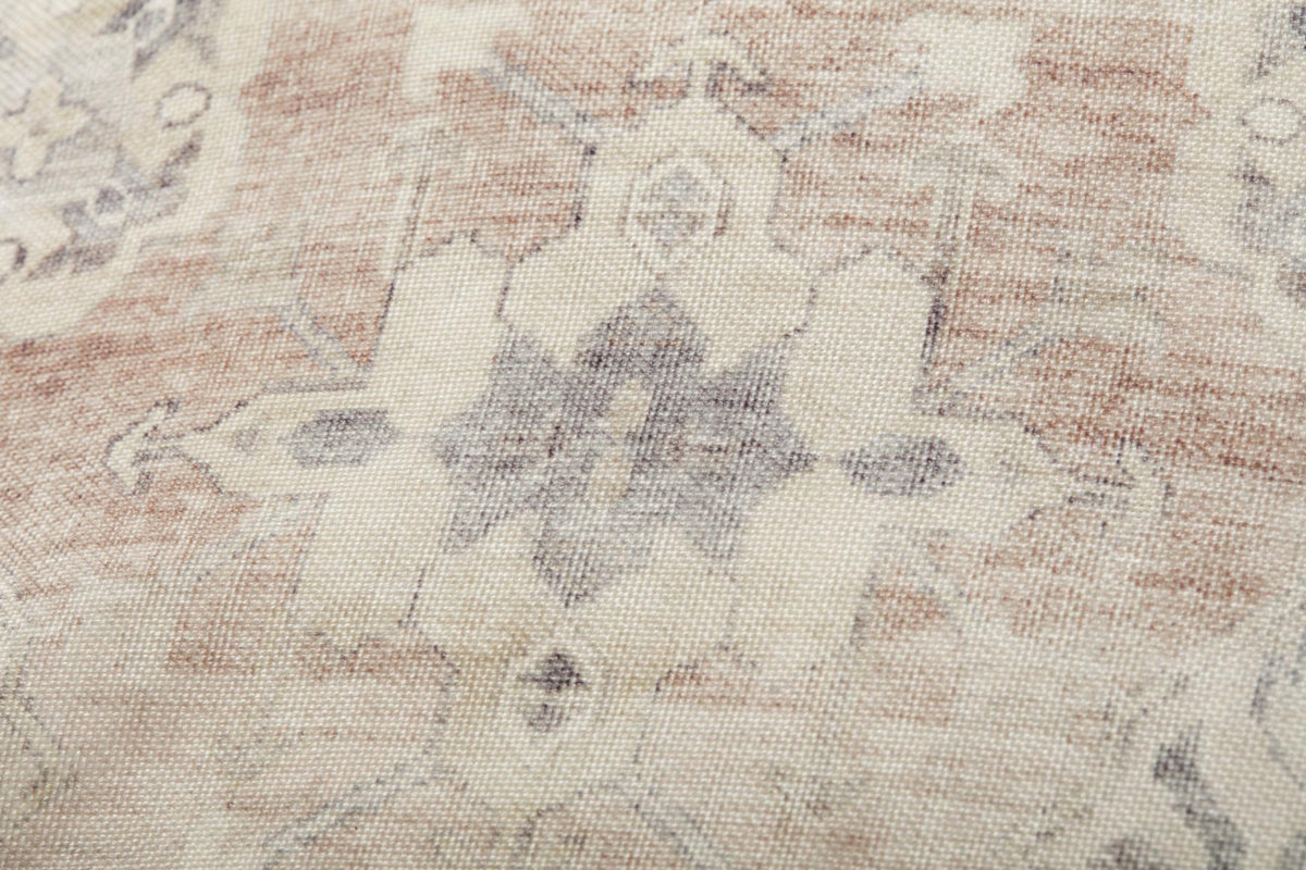 Beige fabric pouf top with gray and rust geometric pattern texture
