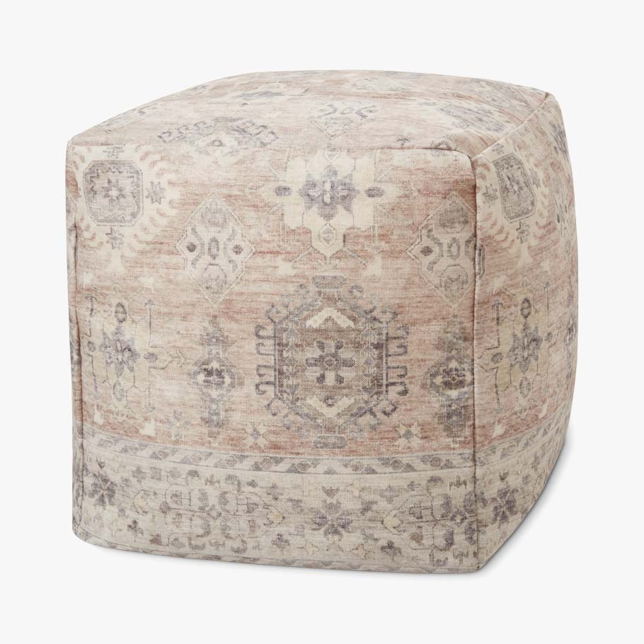 Beige and gray patterned square fabric pouf ottoman with visible seam lines