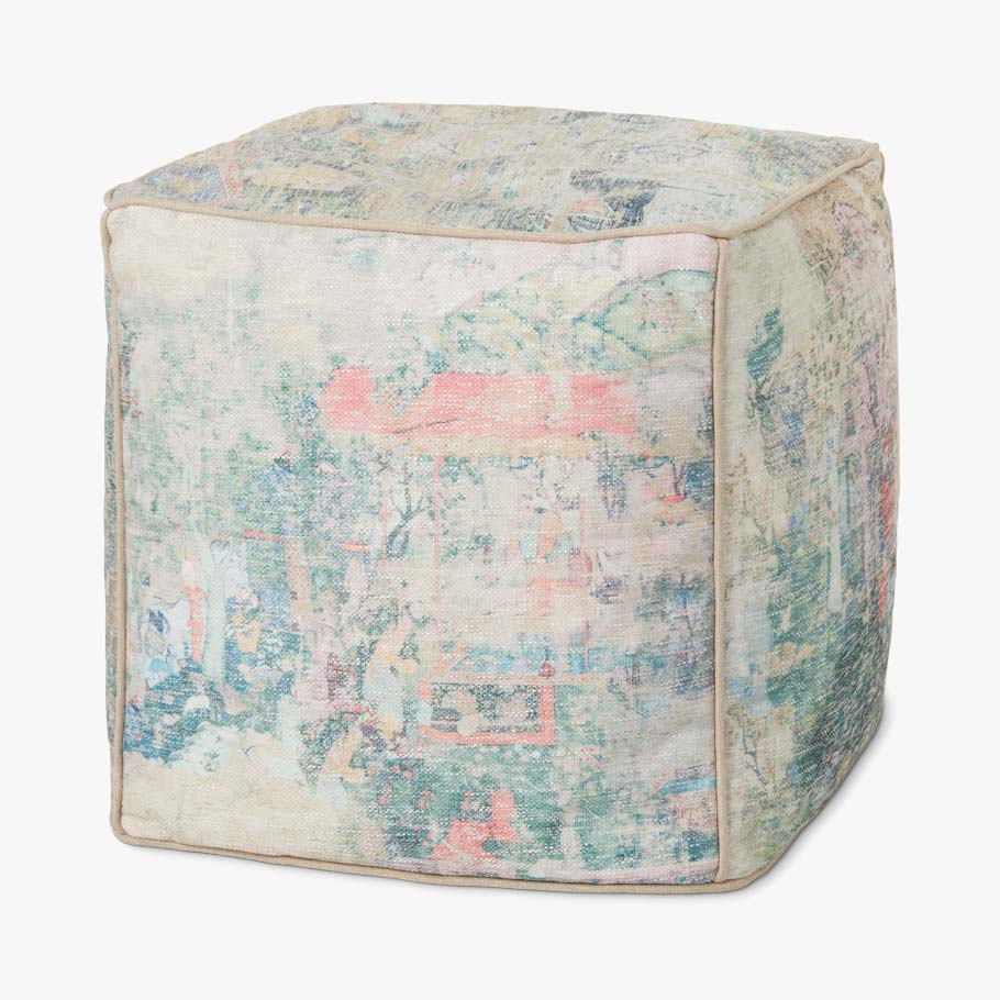 Multicolor patchwork pouf with blue, teal, and coral abstract woven pattern.