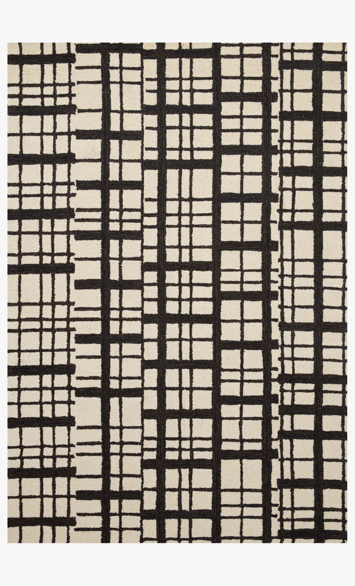 Hand-tufted rug with black and ivory grid patchwork pattern, rectangular shape.