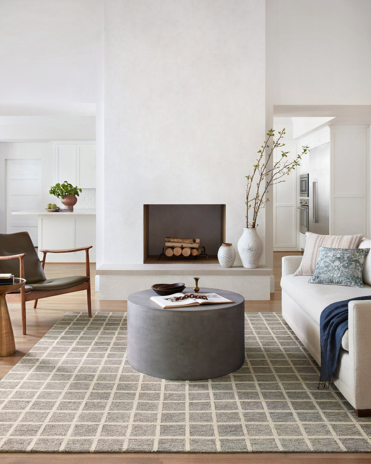 Contemporary slate and ivory patterned rug laid in a living room with gray furniture