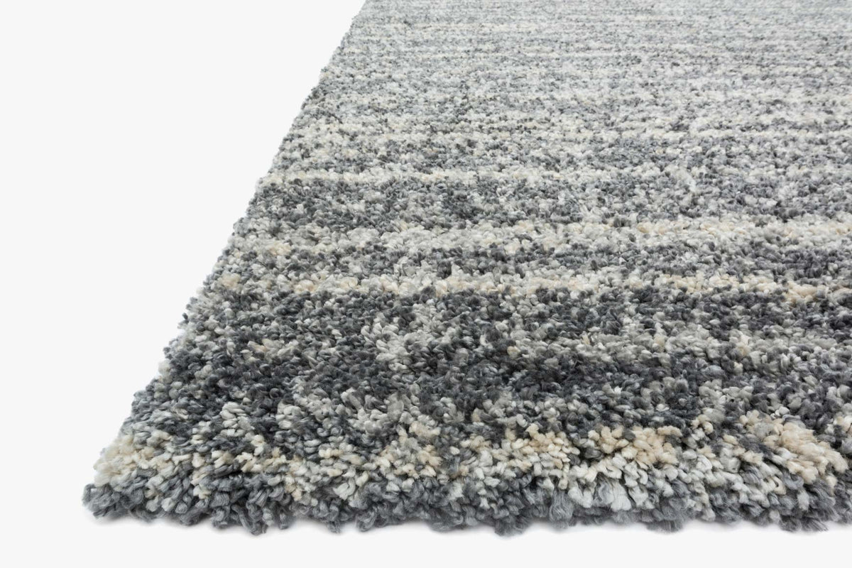 Shag power-loomed rug with speckled gray granite texture and thick pile edge.
