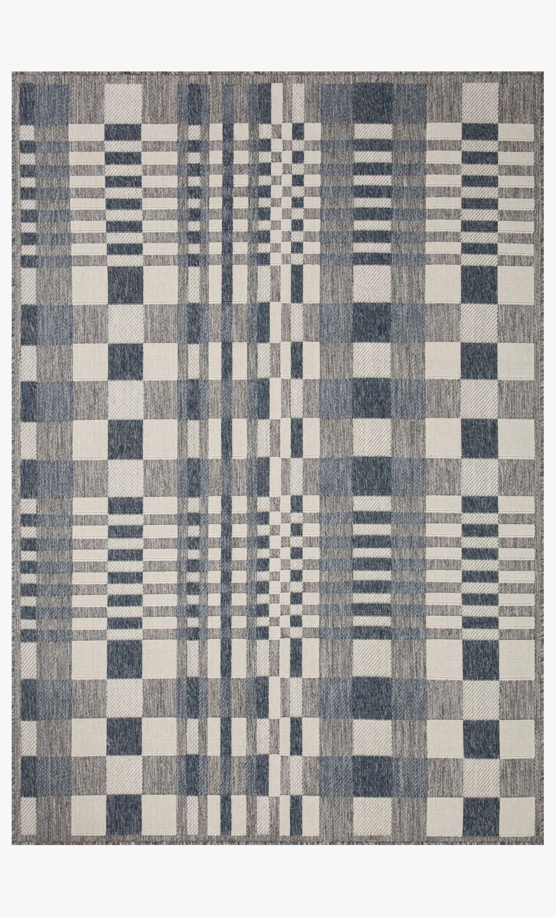 Indoor/outdoor power-loomed rug with patchwork checker design in ivory and denim.