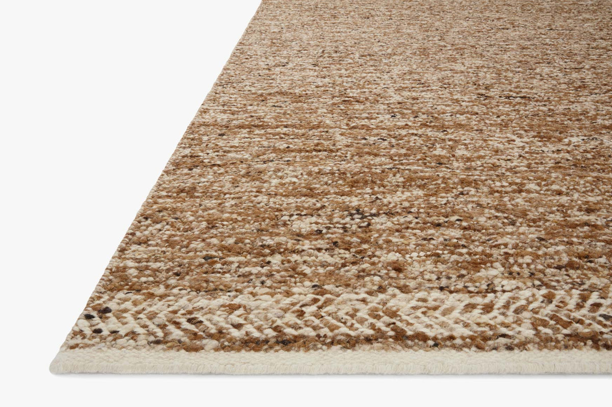 Caramel and ivory contemporary hand-woven rug corner with low-pile woven edge