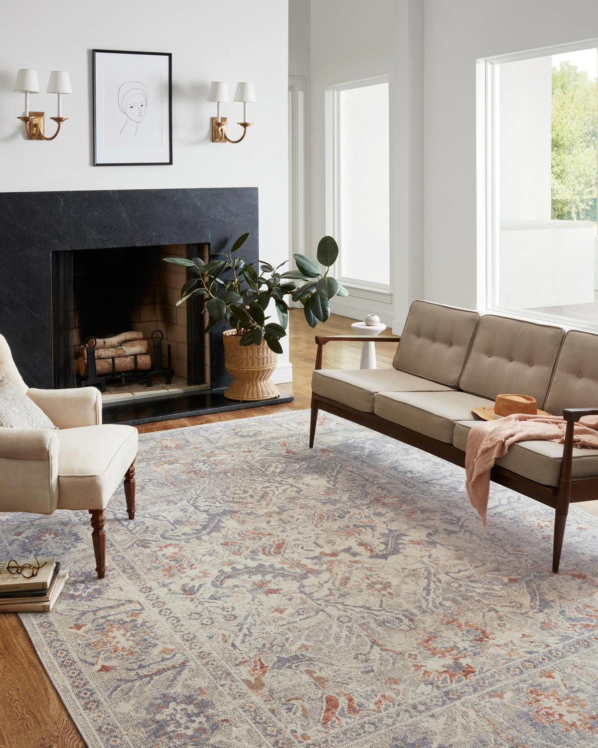 Traditional power-loomed rug in oatmeal with lavender and orange floral motifs under furniture