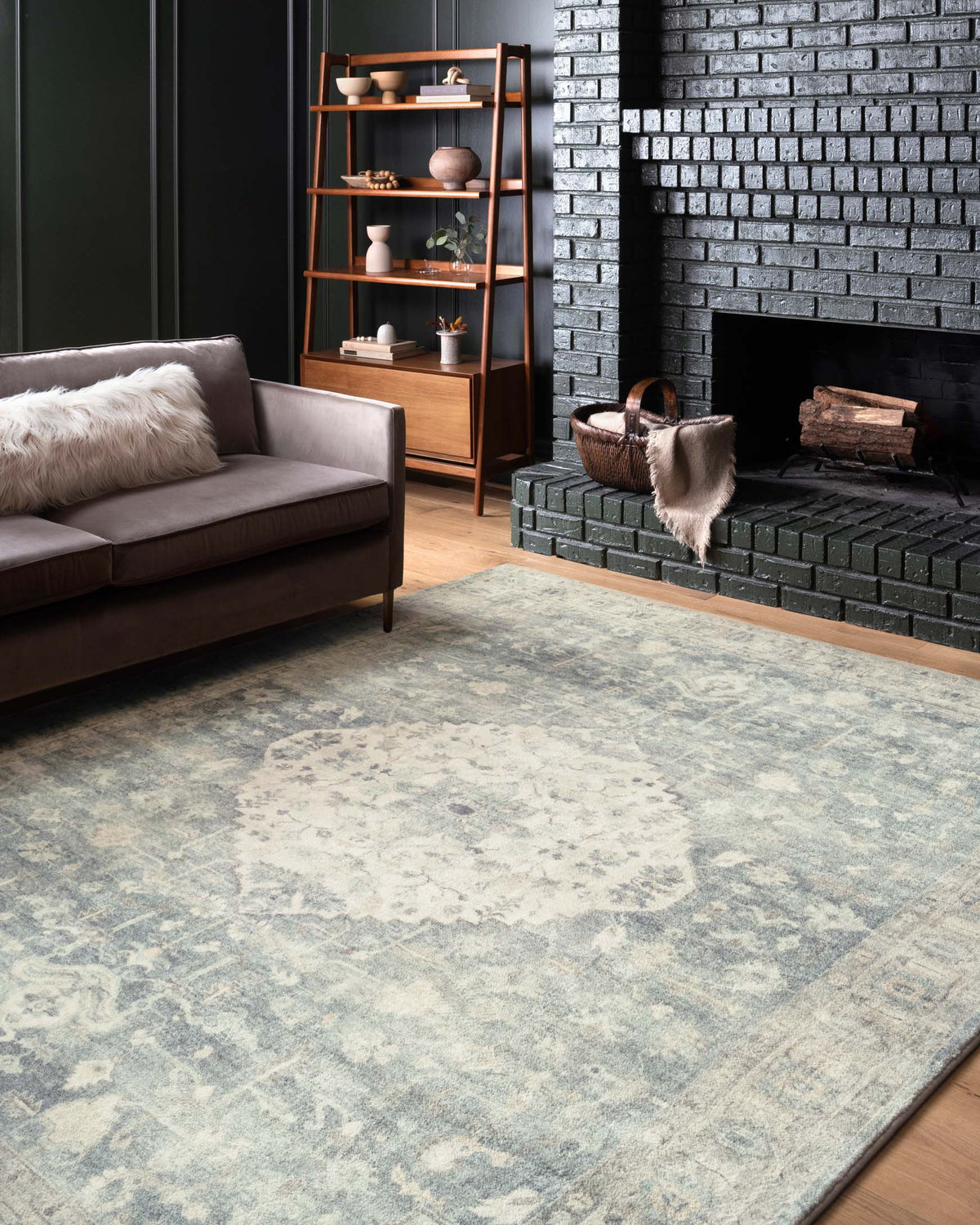 Traditional power-loomed rug with distressed blue-gray medallion motif and border
