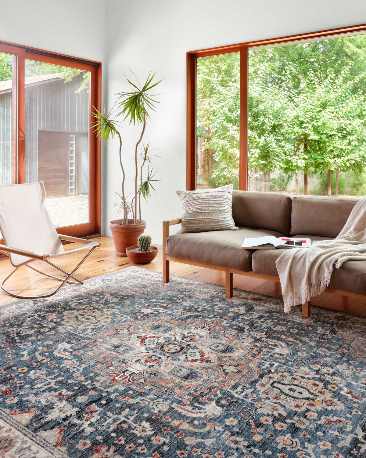 Ornate transitional power-loomed rug in slate-blue with cream and rust details